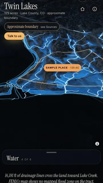 A phone showing a sample 3D map: real terrain, water lines and an amber boundary